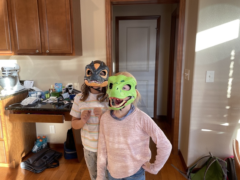 Greta and Emma Dino Masks2.JPG
